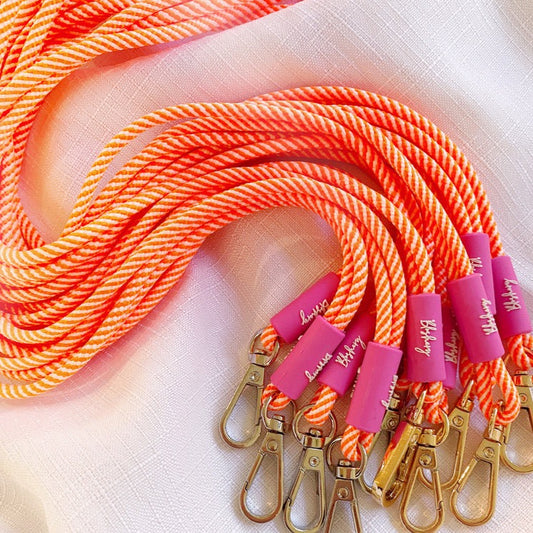 paracord lanyard in neon orange and pink