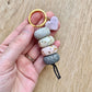 polymer clay beaded keychain in natural stone look with a stone heart charm