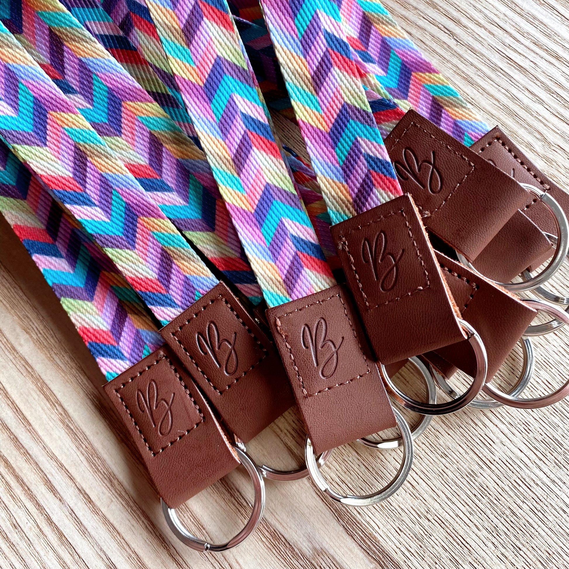 faux leather and polyester wristlet key fob keychains in rainbow print