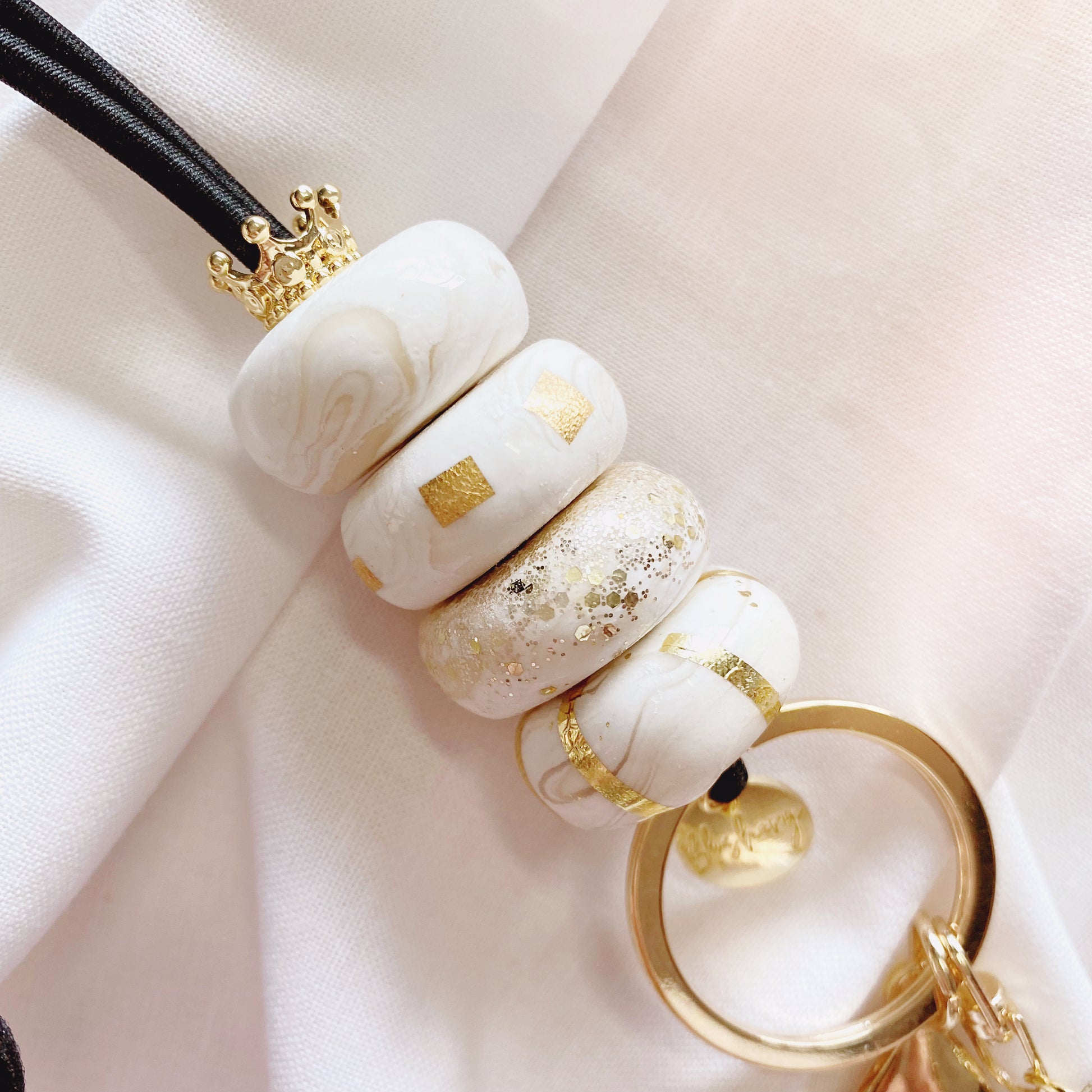 handmade beautiful elegant marble beads with gold leaf and crown charm