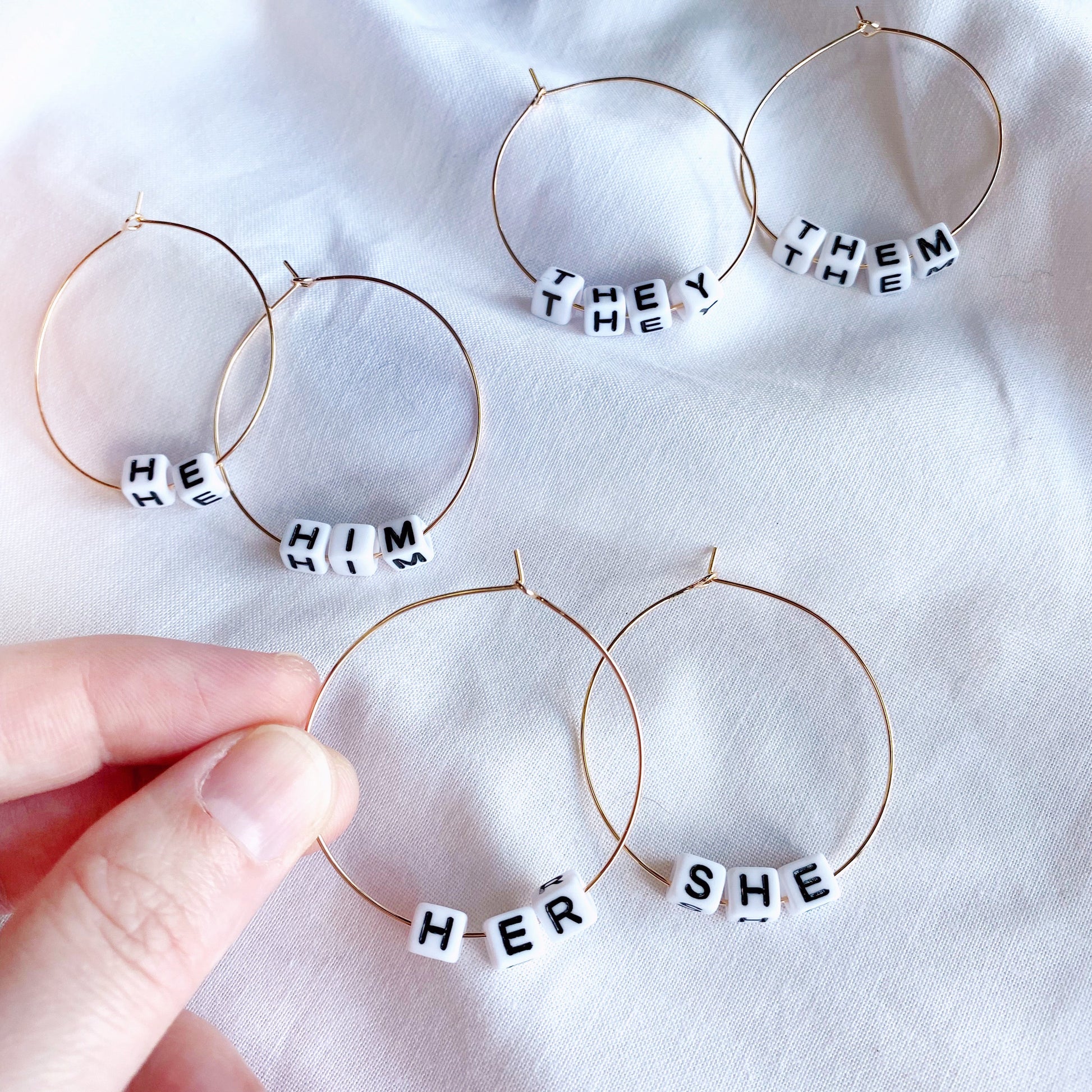 large hoop earrings with tiny alphabet beads with your gender pronouns