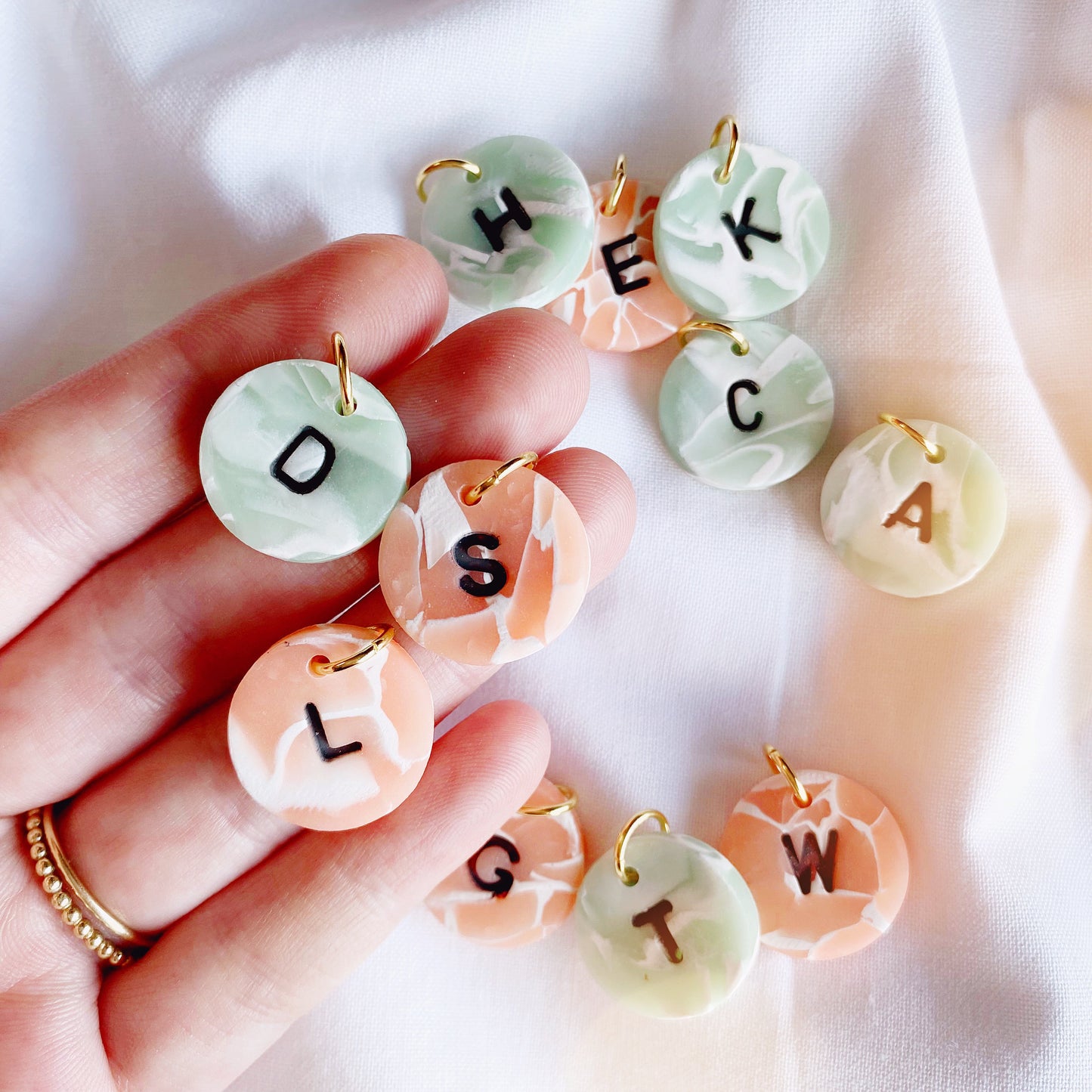 small polymer clay charms, in a gemstone jade and pink colour, stamped with letters in your choice