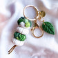 gold plated high quality hardware, and handmade white and green polymer clay beads.