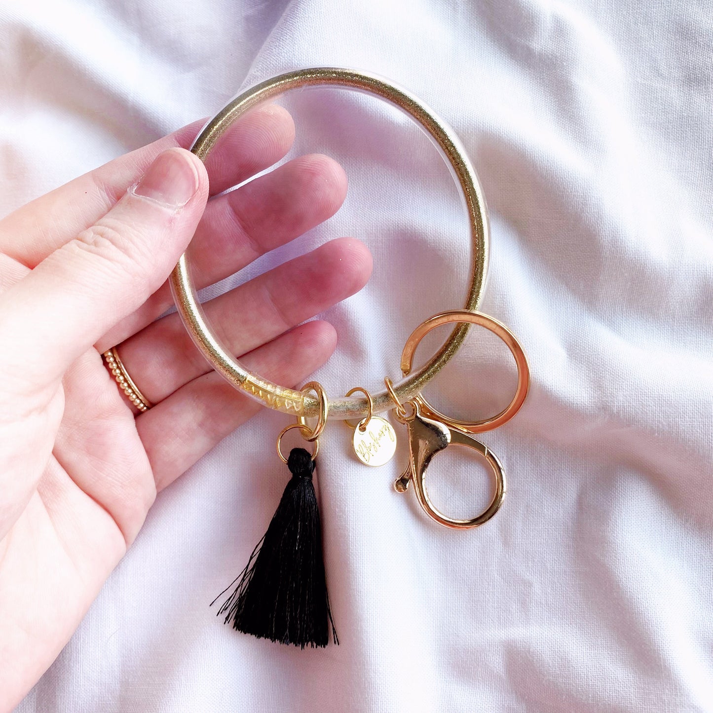 gold and black jelly bangle bracelet and keychain