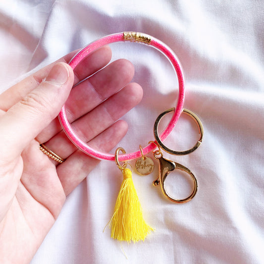 neon pink and yellow glitter filled jelly bangle keychain