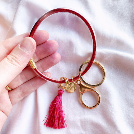 fuchsia pink glitter filled jelly bangle keychain