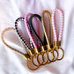braided faux leather keychain in multiple colours with gold hardware