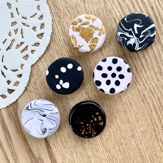 Handmade polymer clay fridge magnets in black and white and gold