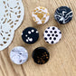 Handmade polymer clay fridge magnets in black and white and gold