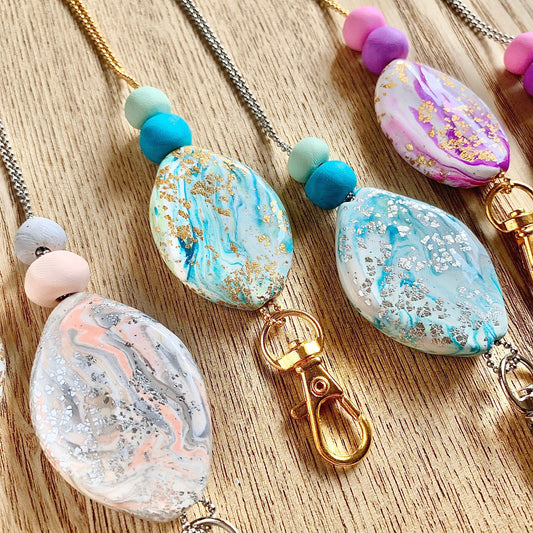 crystal pendant necklaces with different colours to choose from including teal purple and neutral