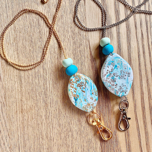 handmade polymer clay pendant lanyard on a thin chain, crystal look, glitter shine gold, gemstone precious stone turquoise blue design