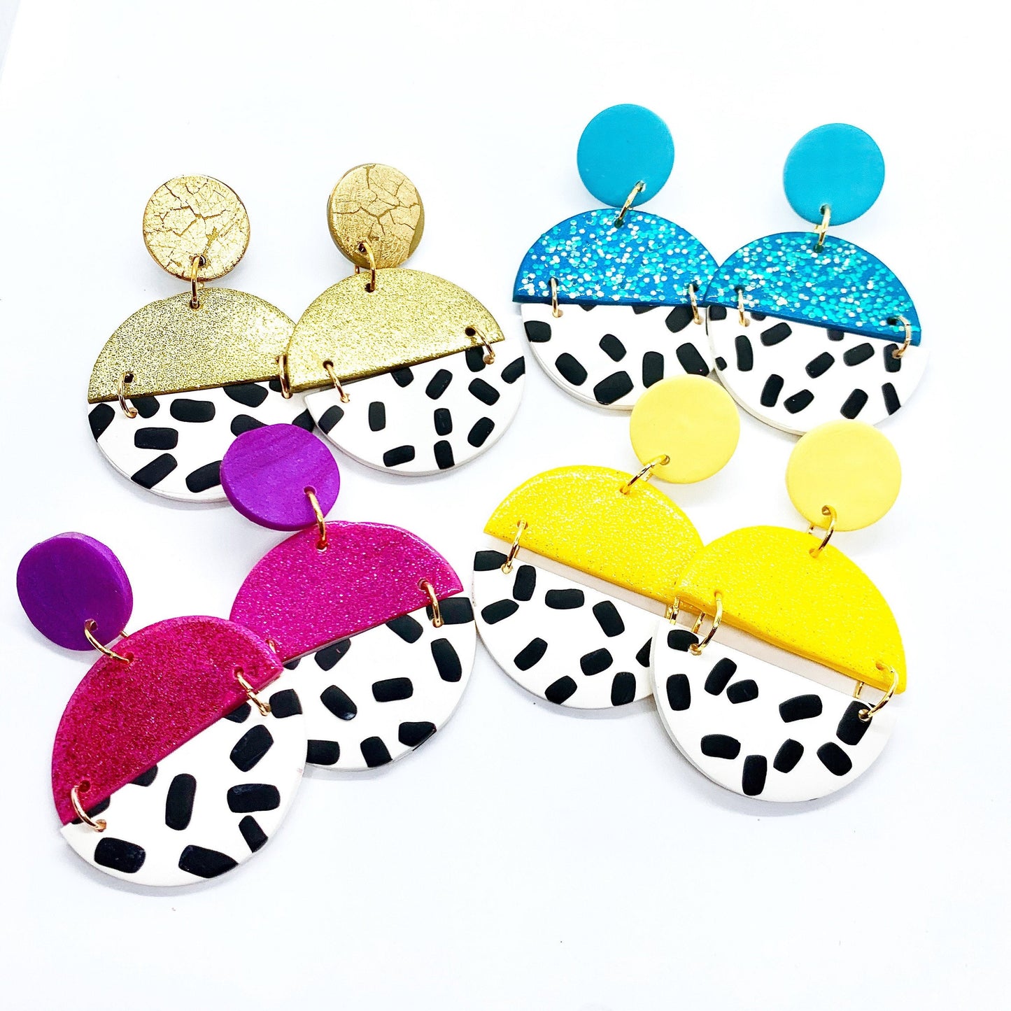 bold drop earrings in blue purple yellow and gold with black and white spots