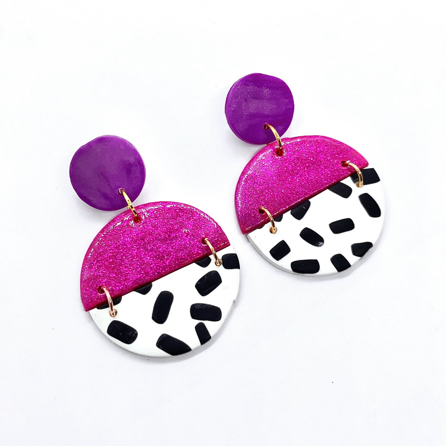 handmade polymer clay earrings in purple pink glitter and black and white polka-dots