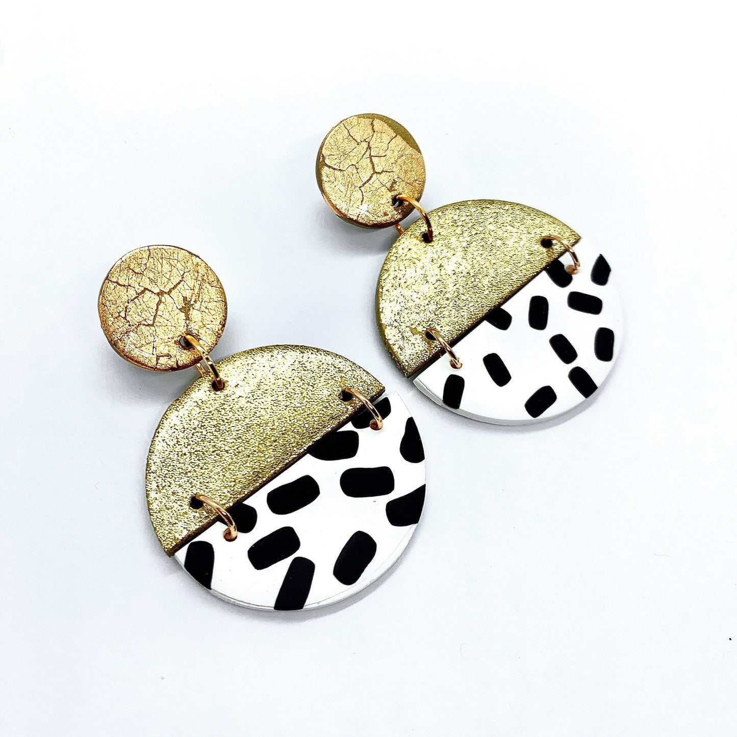 handmade polymer clay earrings in gold glitter and black and white spots