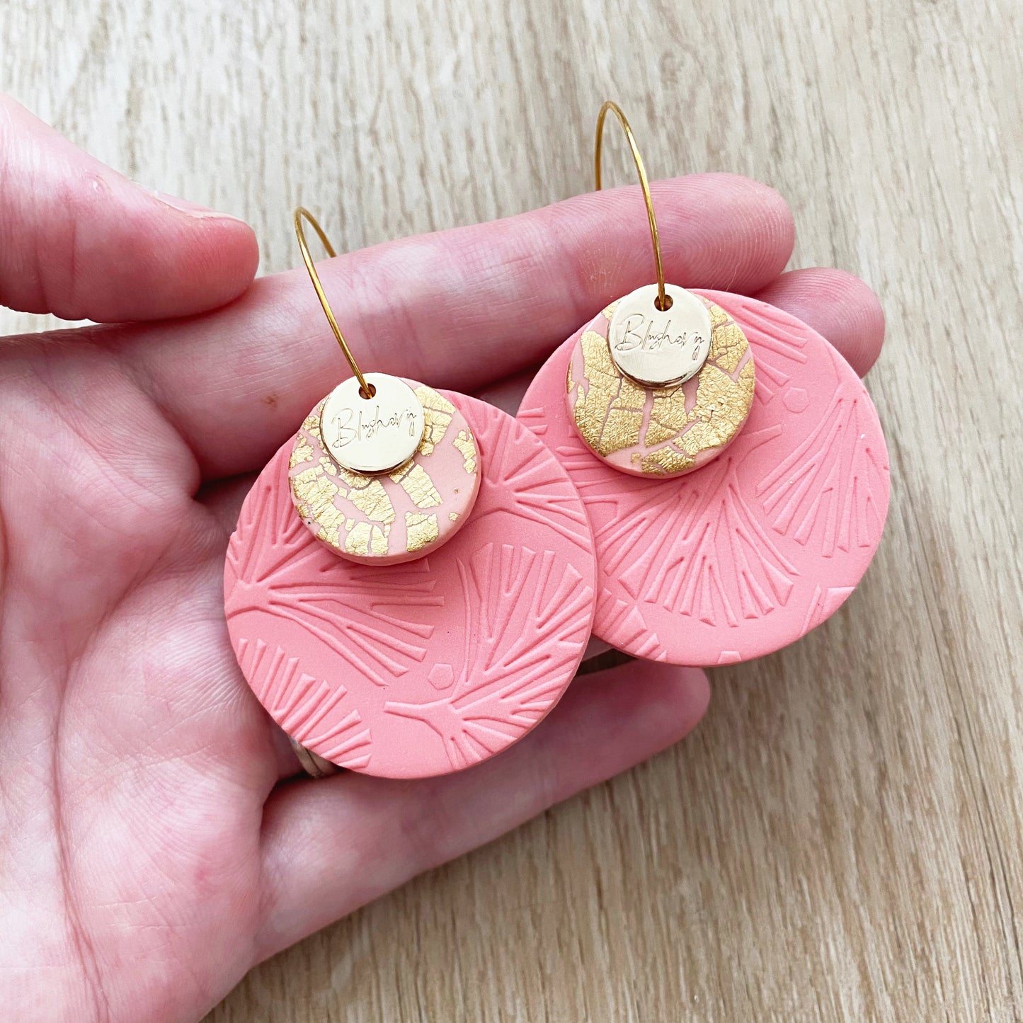 round disc earrings in coral pink and gold, hoops are stainless steel