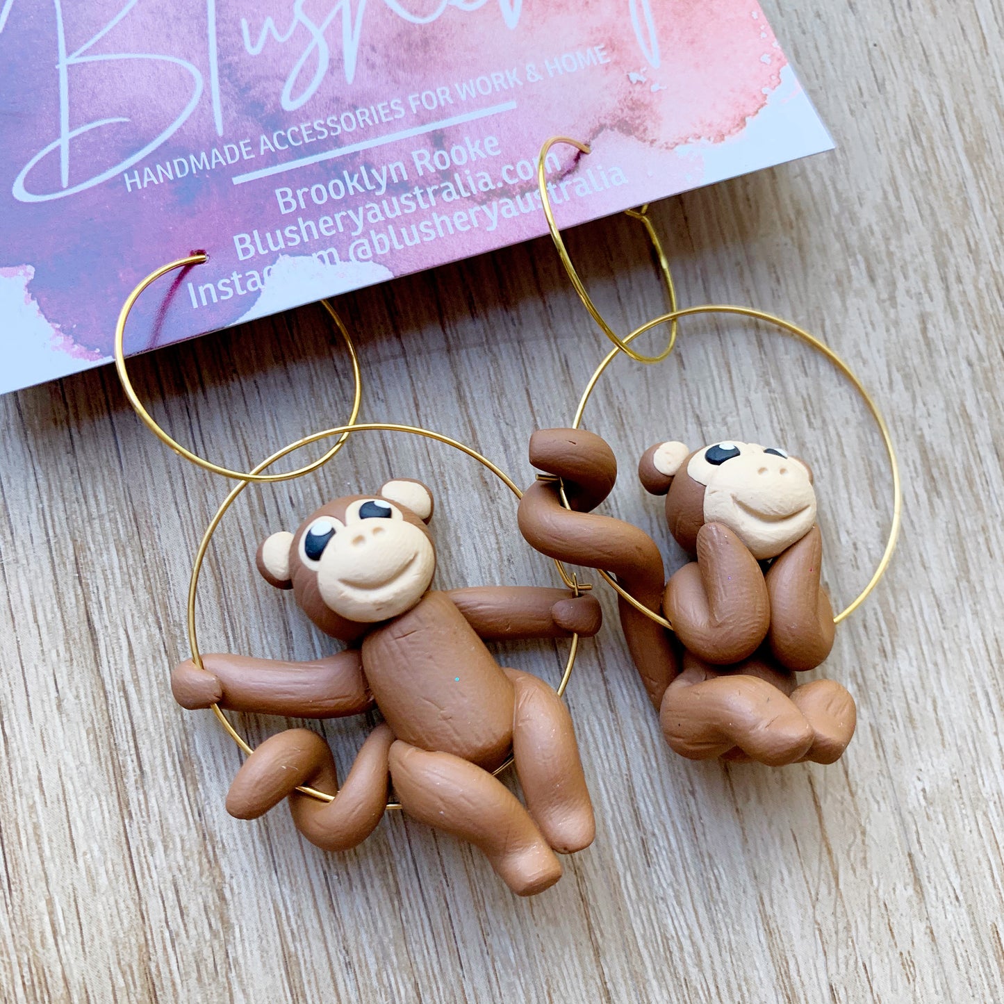 polymer clay monkey earrings, monkeys sitting on a hoop earring