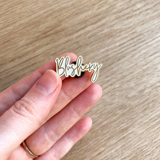 white and gold blushery enamel pin