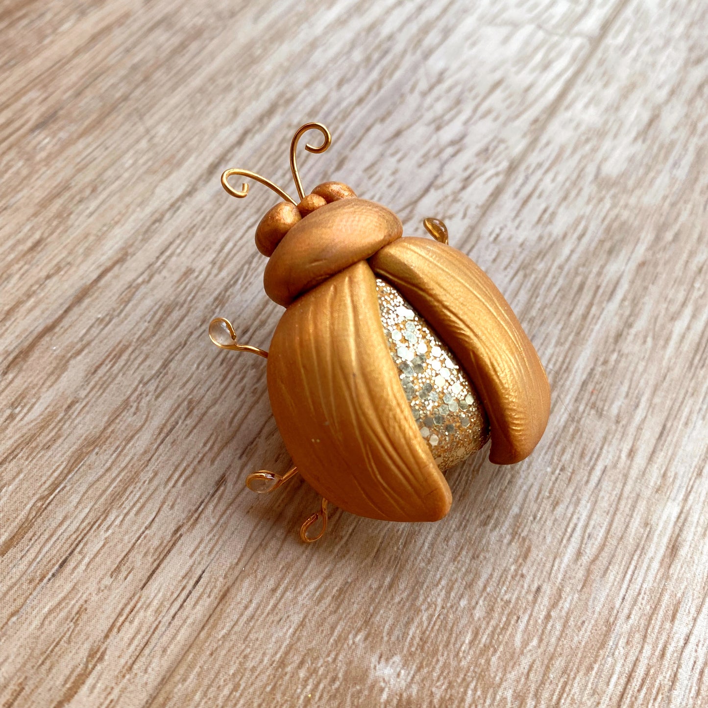 3D polymer clay beetle brooch pin in gold glitter colour