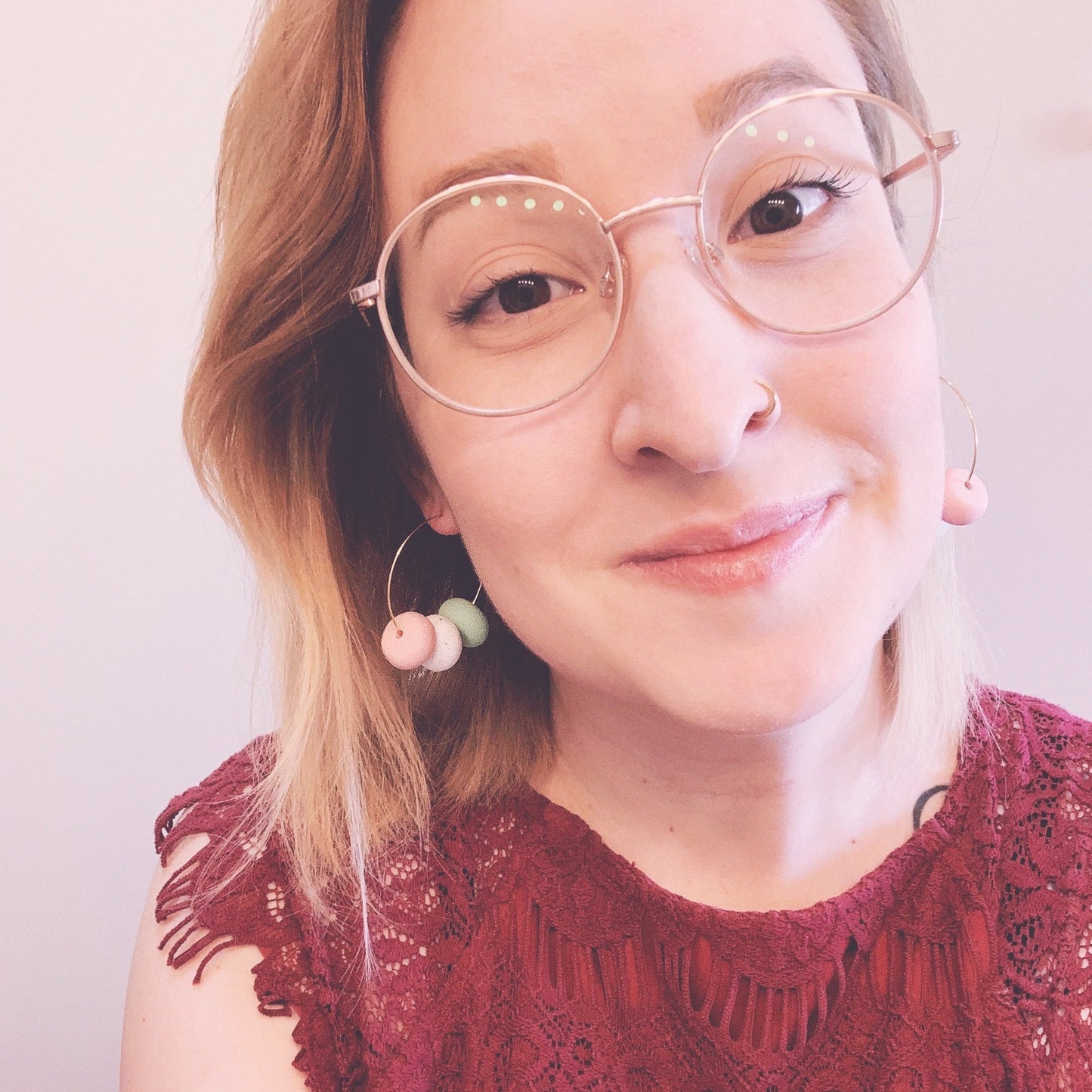 selfie wearing the mint and pink beaded hoop earrings