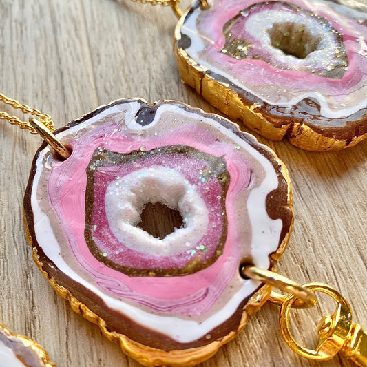 handmade polymer clay geode with layers or clay, glitter and gold leaf