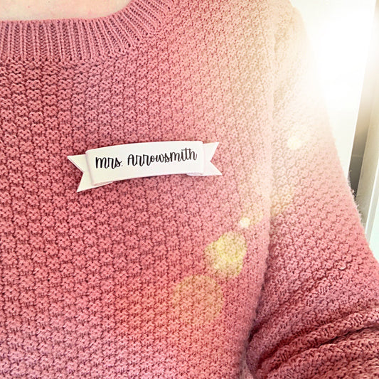 polymer clay name tag badge being worn with work wardrobe 