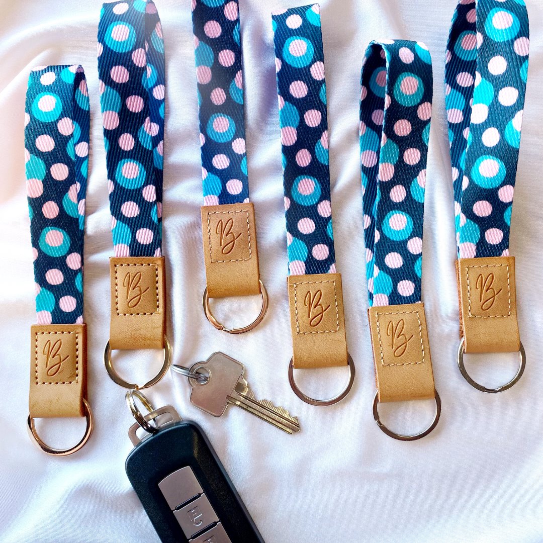 navy blue and pink spotted keychain wristlet