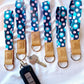 navy blue and pink spotted keychain wristlet