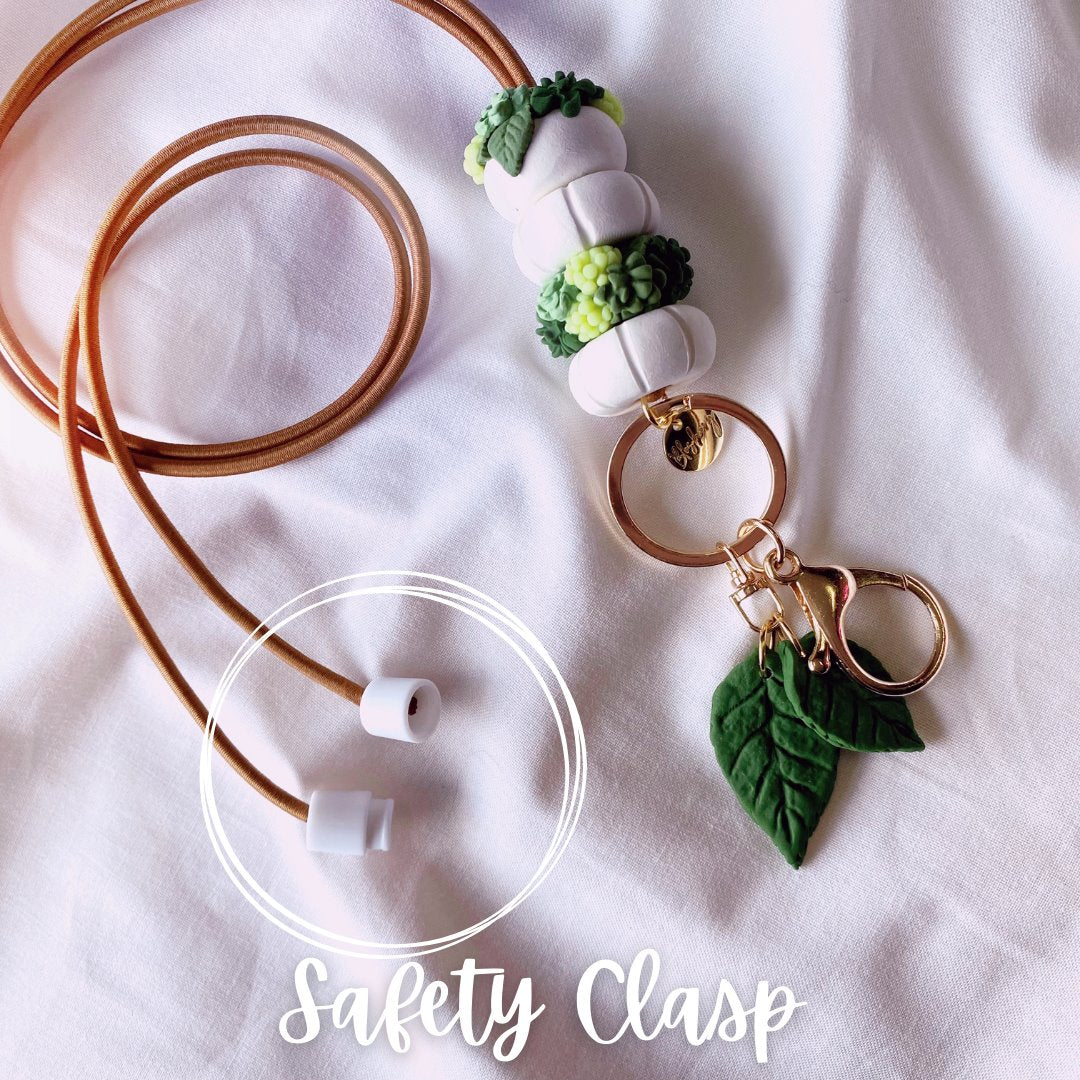 the plant lover lanyard comes with a plastic safety breakaway clasp to meet workplace requirements